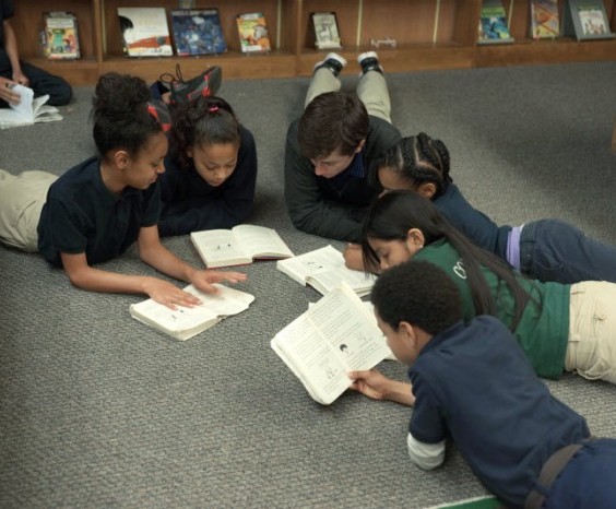 Stonebridge World School Students and Teacher Reading